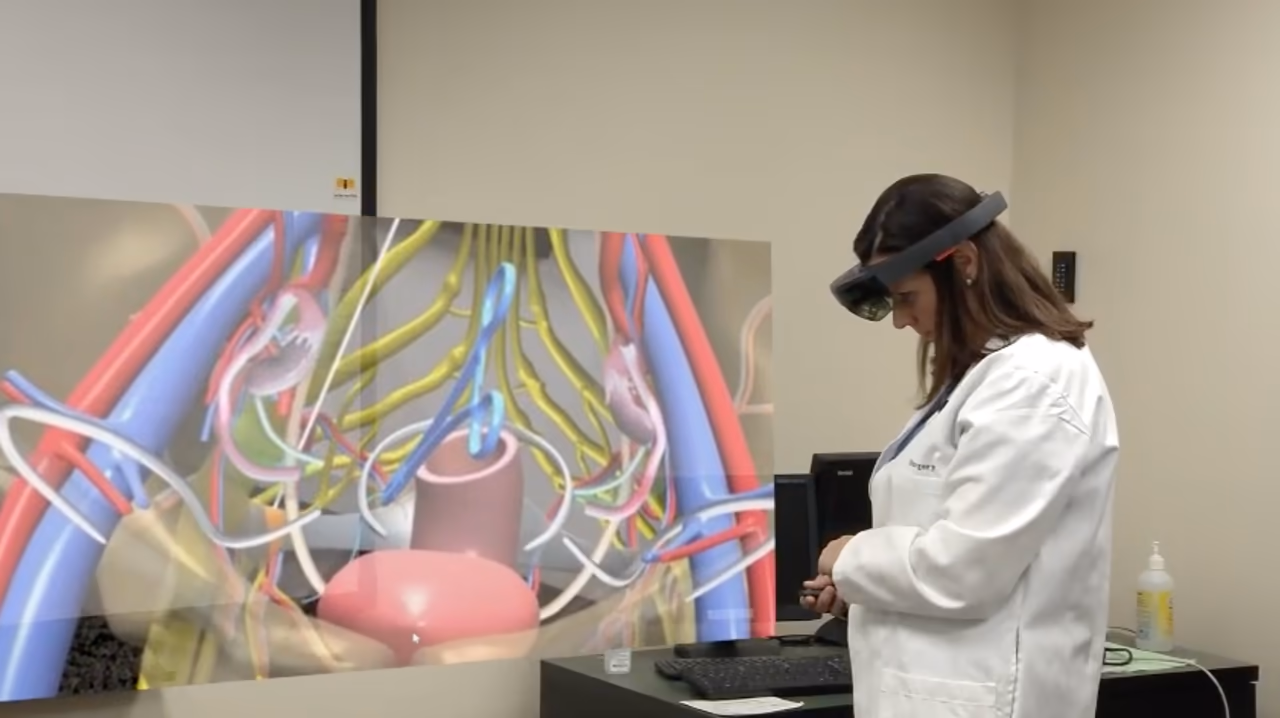 A medical AR case: a clinician wearing mixed reality smartglasses reviews pelvic anatomy as a 3D hologram
